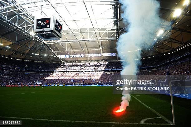 Dortmund´s supporters light fireworks prior to the German first division Bundesliga football match FC Schalke 04 vs Borussia Dortmund in the German...