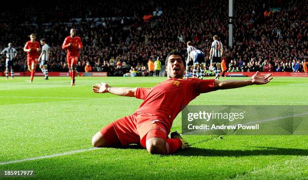 Luis Suarez of Liverpool celebrates his first goal during the Barclays Premier League match between Liverpool and West Bromwich Albion at Anfield on...