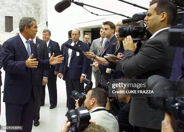 President George W. Bush talks to reporters at the British Museum in London 19 July 2001 about US Senate Majority Leader Tom Daschle's charge that...