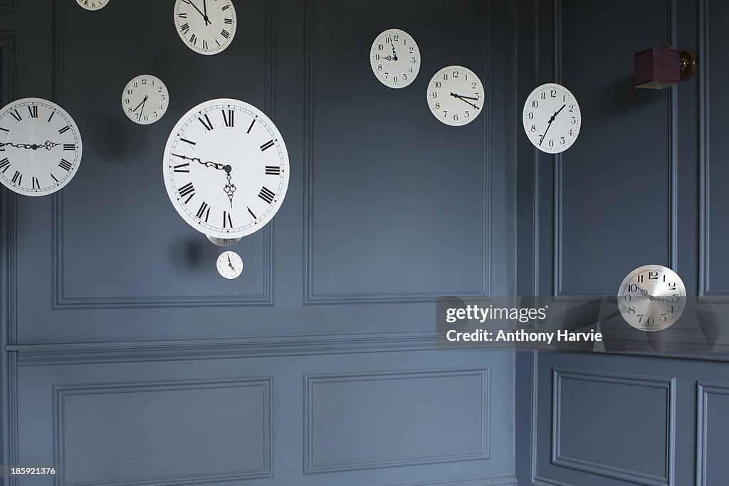 Hanging clocks in sitting room