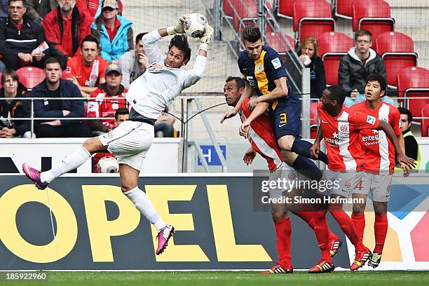 Goalkeeper Heinz Mueller of Mainz makes a save against Ermin Bicakcic of Braunschweig during the Bundesliga match between 1. FSV Mainz and Eintracht...