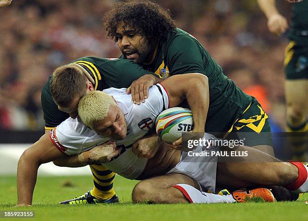 England's Ryan Hall is tackled by Australia's Sam Thaiday during the 2013 Rugby League World Cup group A match between Australia and England at the...