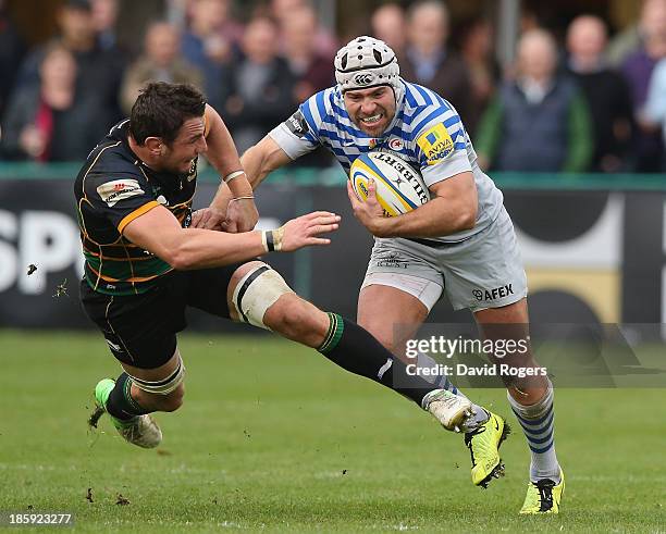 Schalk Brits of Saracens moves past Phil Dowson during the Aviva Premiership match between Northampton Saints and Saracens at Franklin's Gardens on...