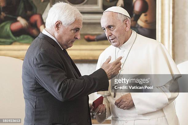 Pope Francis meets with President Ricardo Alberto Martinelli Berrocal of Panama in a private audience at his studio on October 26, 2013 in Vatican...