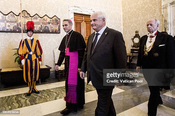 President of Panama, Ricardo Alberto Martinelli Berrocal , flanked by Prefect of the Pontifical House and former personal secretary of Pope Benedict...