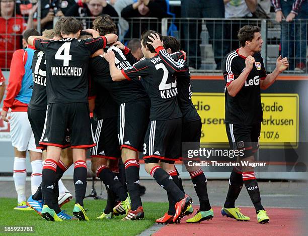 Player of Leverkusen celebrates after lEmre Ca is scoring the seconda goal during the Bundesliga match between Bayer 04 Leverkusen and FC Augsburg at...