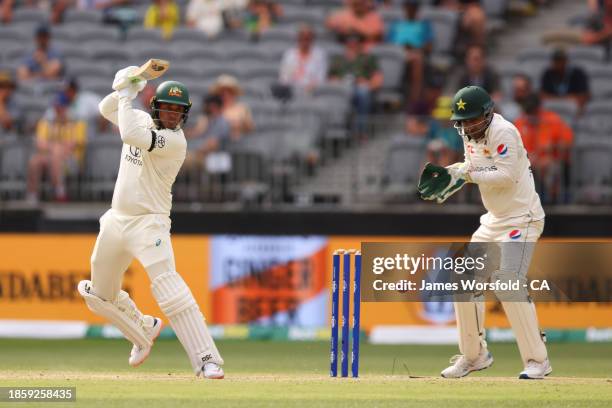 Usman Khawaja of Australia plays a cut shot during day three of the Men's First Test match between Australia and Pakistan at Optus Stadium on...