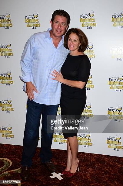 Dan Marino and wife Claire Marino attend the 13th Annual Footy's Bubbles & Bones Gala at Westin Diplomat on October 25, 2013 in Hollywood, Florida.