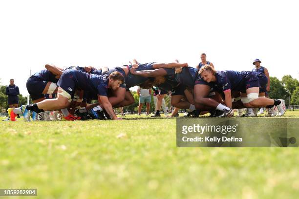 Rebels Men's players form a scrum during a Melbourne Rebels Open Training Session at Gosch's Paddock on December 16, 2023 in Melbourne, Australia.