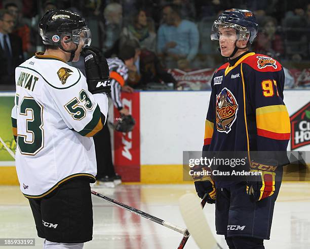 Connor McDavid of the Erie Otters chats with Bo Horvat of the London Knights during an OHL game at the Budweiser Gardens on October 25, 2013 in...