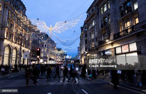 Christmas lights along Regent Street in London, UK, on Monday, Dec. 18, 2023. The Office for National Statistics are due to release the latest UK...