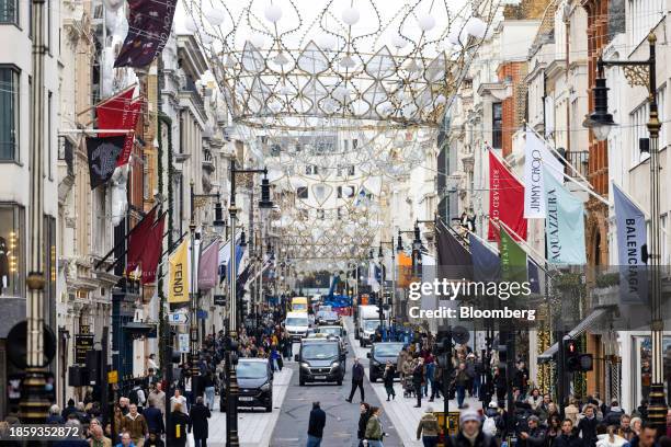 Shoppers on New Bond Street in London, UK, on Monday, Dec. 18, 2023. The Office for National Statistics are due to release the latest UK retail sales...