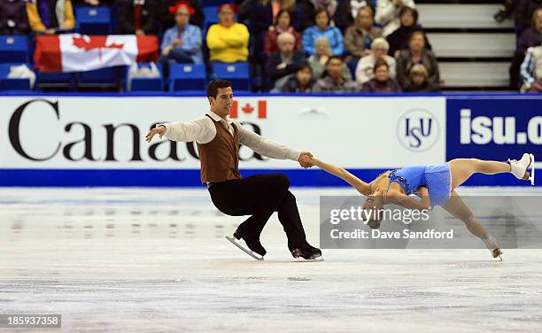 Paige Lawrence and Rudi Sweigers of Canada skate during the pairs free program on day two at the ISU GP 2013 Skate Canada International at Harbour...