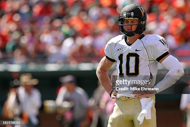 Tanner Price of the Wake Forest Demon Deacons looks on during a game against the Miami Hurricanes at Sun Life Stadium on October 26, 2013 in Miami...