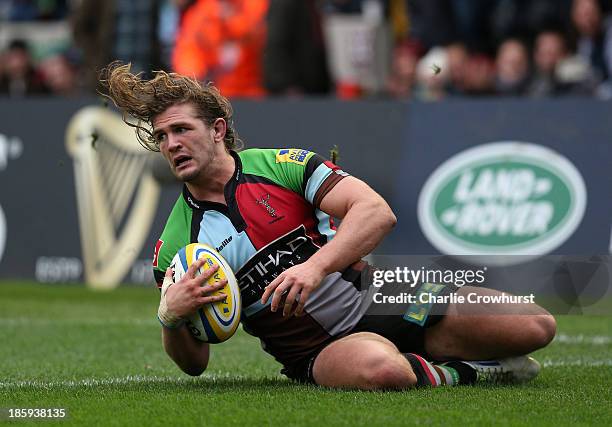 Luke Wallace of Harlequins goes over to score the teams first try during the Aviva Premiership Rugby match between Harlequins and Sale Sharks at...