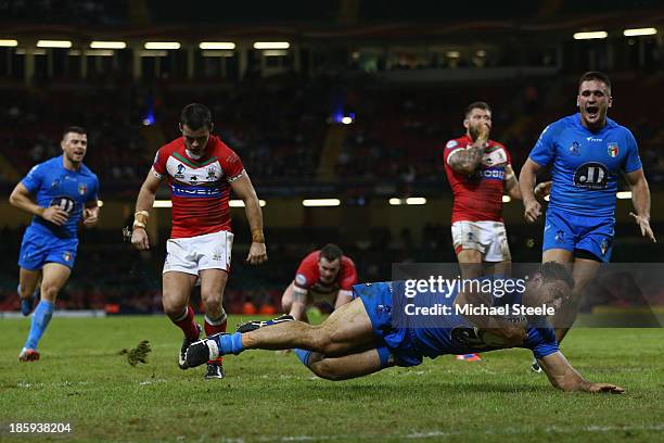 Mark Minichiello of Italy scores a try during the Rugby League World Cup Inter group match between Wales and Italy at the Millennium Stadium on...