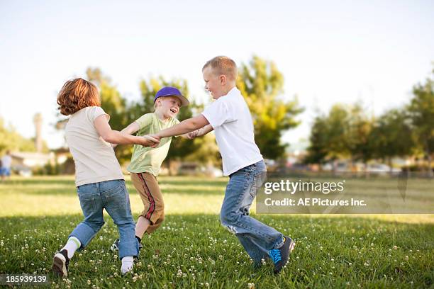 children play at park - children dancing outside stock pictures, royalty-free photos & images