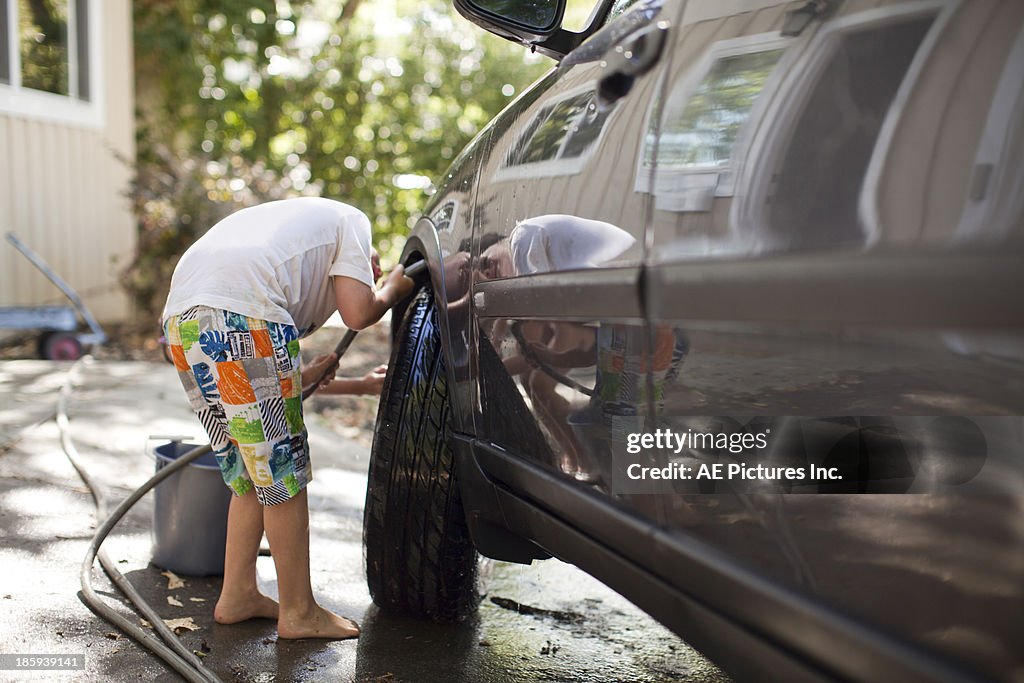 Boy washing car