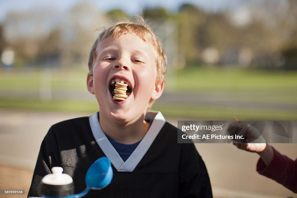 Boy eating tower of cracker