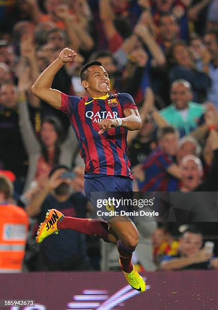 Alexis Sanchez of FC Barcelona celebrates after scoring his team's second goal during the La Liga match between FC Barcelona and Real Madrid CF at...