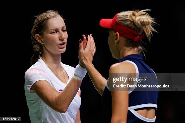 Ekaterina Makarova and Elena Vesnina both of Russia celebrate a point against Sara Errani and Roberta Vinci both of Italy in their semi final match...