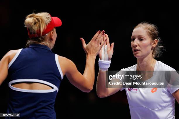 Ekaterina Makarova and Elena Vesnina both of Russia celebrate a point against Sara Errani and Roberta Vinci both of Italy in their semi final match...