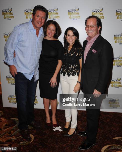 Dan Marino, Claire Marino, Marc Levinson and Robin Levinson attend the 13th Annual Footy's Bubbles & Bones Gala at Westin Diplomat on October 25,...