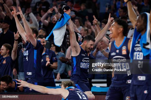 Chris Goulding of United and the team celebrate a three pointer to Campbell Blogg of United before the buzzer after winning the round 11 NBL match...