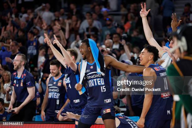 Ariel Hukporti of United and the team celebrate a three pointer to Campbell Blogg of United before the buzzer after winning the round 11 NBL match...