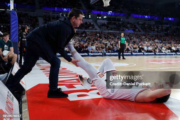 Dejan Vasiljevic of the 36ers cramps up during the round 11 NBL match between Melbourne United and Adelaide 36ers at John Cain Arena, on December 16...