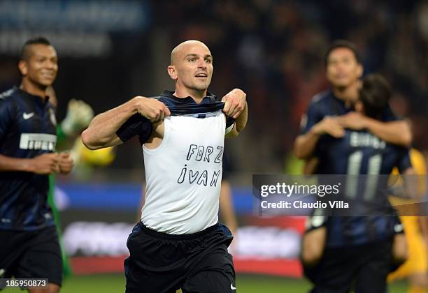 Esteban Cambiasso of FC Inter Milan celebrates scoring the third goal during the Serie A match between FC Internazionale Milano and Hellas Verona at...