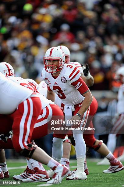 Taylor Martinez of the Nebraska Cornhuskers calls a play at the line of scrimmage during the fourth quarter of the game against the Minnesota Golden...