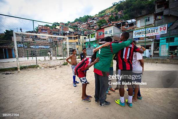 Boys prepare for training at the Vila Nova Project in the Morro dos Macacos area on October 26, 2013 in Rio de Janeiro, Brazil. The Project Vila Nova...