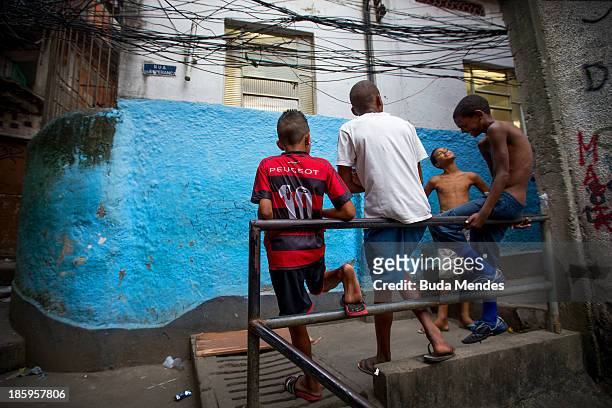 Boys talk near the Vila Nova Project in the Morro dos Macacos area on October 26, 2013 in Rio de Janeiro, Brazil. The Project Vila Nova was idealized...
