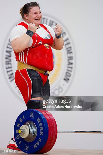 Katsiaryna Shkuratava from Belarus celebrates her lift in the Clean & Jerk competition women's +75 kg Group A during weightlifting IWF World...