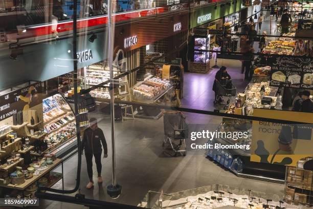 Shoppes inside a food hall at a grocery market in Kyiv, Ukraine, on Tuesday, Dec. 19, 2023. With more than $110 billion in assistance mired in...