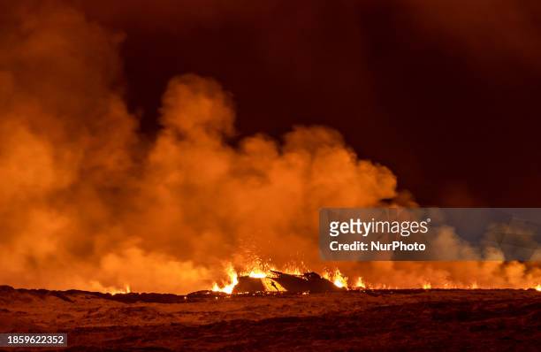 Volcano spews lava and smoke as it erupts in Grindavik, Iceland, December 18, 2023.