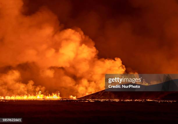 Volcano spews lava and smoke as it erupts in Grindavik, Iceland, December 18, 2023.