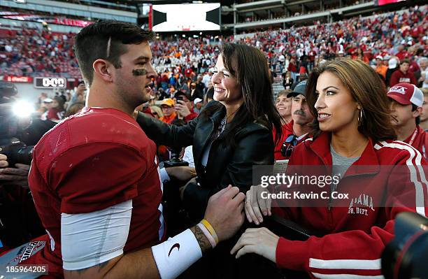 McCarron of the Alabama Crimson Tide celebrates their 45-10 win over the Tennessee Volunteers with mom Dee Dee Bonner and girlfriend Katherine Webb...