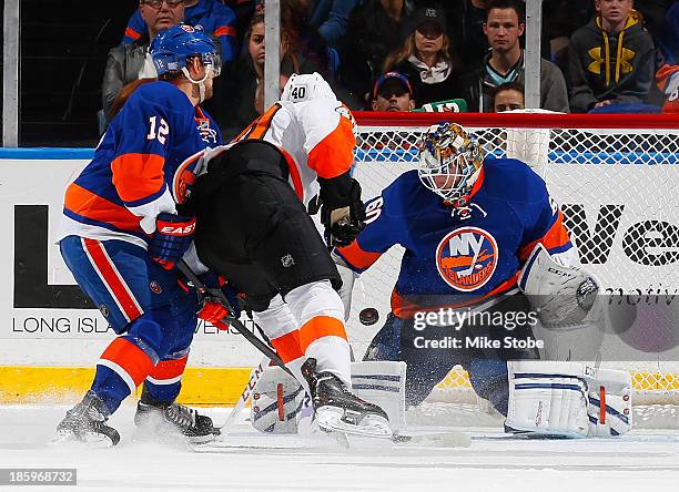 Vincent Lecavalier of the Philadelphia Flyers puts the puck past Kevin Poulin of the New York Islanders during the first period at Nassau Veterans...