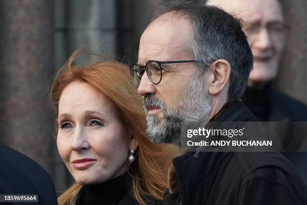 Author JK Rowling and her husband Neil Murray leave at the end of the funeral service of former British Chancellor of the Exchequer Alistair Darling...