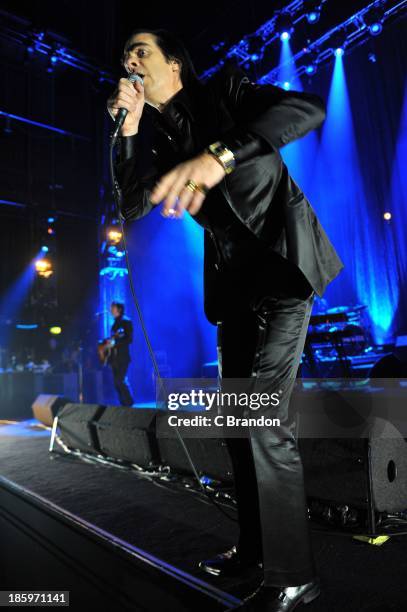Nick Cave of Nick Cave And The Bad Seeds performs on stage at Hammersmith Apollo on October 26, 2013 in London, England.