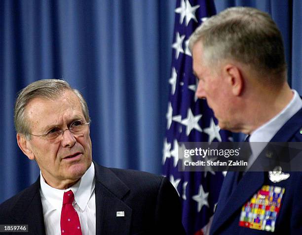Secretary of Defense Donald Rumsfeld and the Chairman of the Joint Chiefs of Staff General Richard Myers speak at the Pentagon March 20, 2003 in...