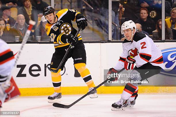 Shawn Thornton of the Boston Bruins shoots the puck against Marek Zidlucky of the New Jersey Devils at the TD Garden on October 26, 2013 in Boston,...