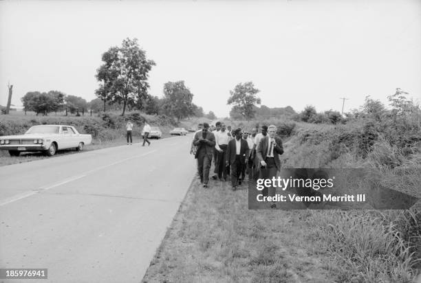 American Civil Rights leaders march, with others, to encourage voter registration, Mississippi, June 1966. Among those pictured are Floyd McKissick ,...