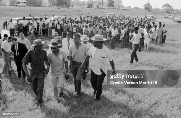 American Civil Rights leaders, from fore left, Floyd McKissick , Dr Martin Luther King Jr , and Stokely Carmichael talk amongst themselves during a...