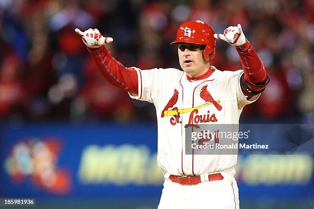 Allen Craig of the St. Louis Cardinals celebrates his ninth inning double against the Boston Red Sox during Game Three of the 2013 World Series at...