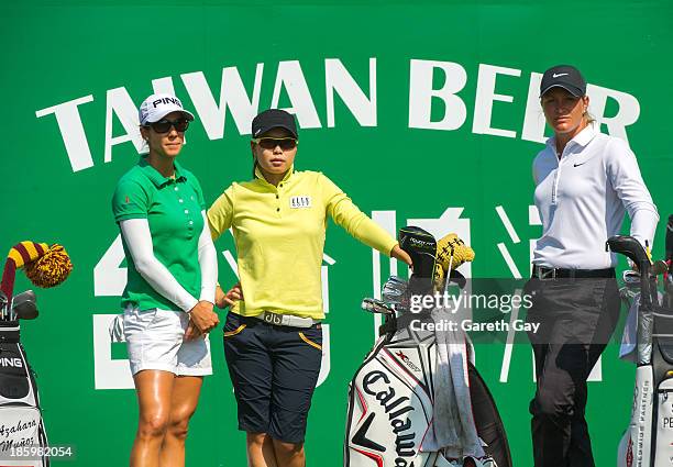 Azahara Munoz of Spain, Sun Young Yoo of South Korea and Suzann Pettersen of Norway, wait to start play on the second hole during day four of the...