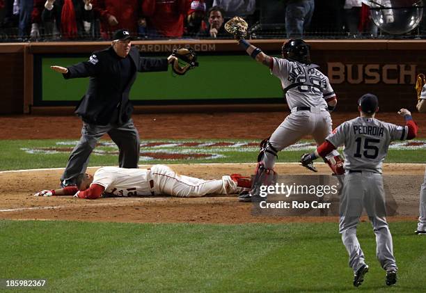 Jarrod Saltalamacchia and Dustin Pedroia of the Boston Red Sox react as Home Plate Umpire Dana DeMuth calls Allen Craig of the St. Louis Cardinals...