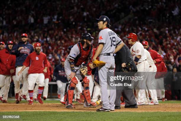 Koji Uehara of the Boston Red Sox reacts after Allen Craig of the St. Louis Cardinals was called safe at home to win Game Three of the 2013 World...